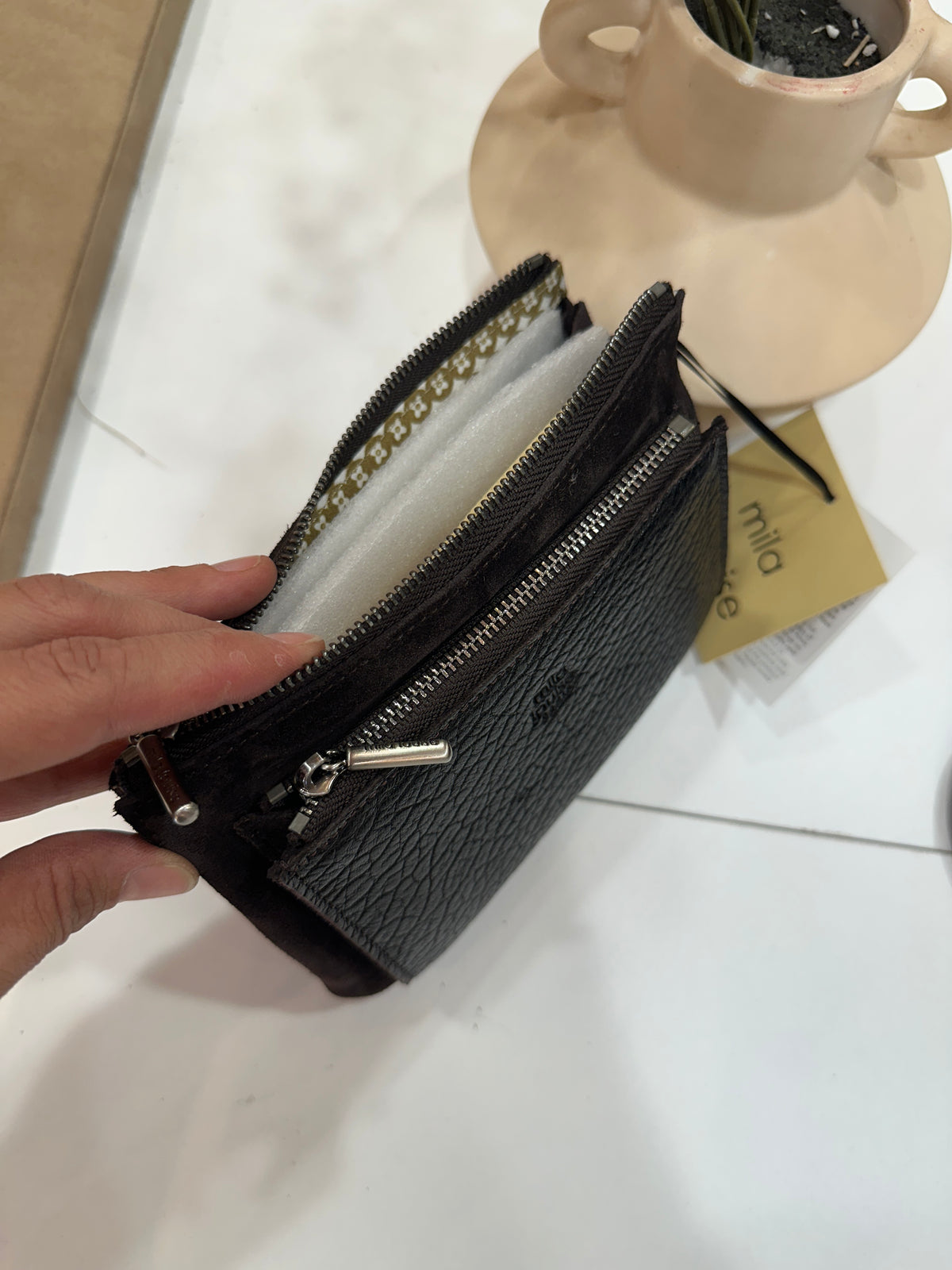 Monedero Plom E1